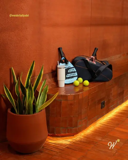 Terracotta bench with a racket bag