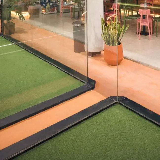 Corner of the panoramic glass on green turf