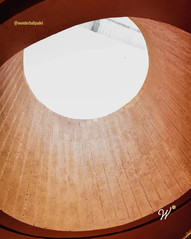 Round skylight in a terracotta ceiling